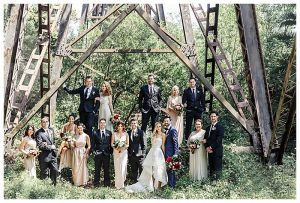 A few highlights from this wedding is the High low wedding dress, the whimsical bridesmaids style, and the stunning wedding decor